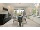 Modern dining room with glass table and access to deck at 7 Elk Pointe Ln, Castle Rock, CO 80108