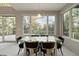 Modern dining area with glass table and stunning views at 7 Elk Pointe Ln, Castle Rock, CO 80108