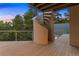 Exterior spiral staircase leading to a deck with wooded views at 7 Elk Pointe Ln, Castle Rock, CO 80108