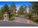 Landscaped driveway leading to modern home with stone accents at 7 Elk Pointe Ln, Castle Rock, CO 80108