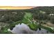 Golf course community with a lake and beautiful sunset views at 7 Elk Pointe Ln, Castle Rock, CO 80108