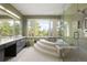 Spa-like bathroom with a large soaking tub and a walk-in shower at 7 Elk Pointe Ln, Castle Rock, CO 80108