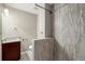 Clean bathroom with a shower and granite countertop at 3092 S Kearney St, Denver, CO 80222