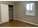 Bright bedroom with hardwood floors and closet at 3092 S Kearney St, Denver, CO 80222