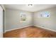 Bright bedroom featuring hardwood floors and ample natural light at 3092 S Kearney St, Denver, CO 80222
