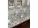 Granite countertop with under cabinet lighting and stainless steel sink at 3092 S Kearney St, Denver, CO 80222