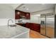 Modern kitchen with stainless steel appliances and granite countertops at 3092 S Kearney St, Denver, CO 80222