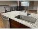 Kitchen island with granite countertop and stainless steel sink at 3092 S Kearney St, Denver, CO 80222