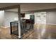 Open living area with hardwood floors and modern staircase at 3092 S Kearney St, Denver, CO 80222