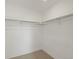 Spacious closet with ample shelving and hanging rods at 2048 S Holly St # 1, Denver, CO 80222