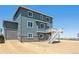 Two-story home with grey siding and a deck at 3362 N Highlands Creek Pkwy, Aurora, CO 80019
