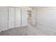 Spacious bedroom with carpet flooring, neutral walls and a view at 3362 N Highlands Creek Pkwy, Aurora, CO 80019