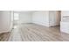 Bright and airy living room with gray vinyl plank flooring at 3362 N Highlands Creek Pkwy, Aurora, CO 80019