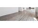 Open concept living room showcasing gray vinyl plank flooring at 3362 N Highlands Creek Pkwy, Aurora, CO 80019