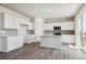 Modern kitchen featuring white cabinets, gray countertops, and stainless steel appliances at 3362 N Highlands Creek Pkwy, Aurora, CO 80019