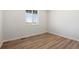 Simple office with hardwood floors and a large window at 3362 N Highlands Creek Pkwy, Aurora, CO 80019