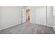 Well-lit bedroom with carpet flooring and an ensuite bathroom at 3362 N Highlands Creek Pkwy, Aurora, CO 80019