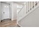 Bright and spacious entryway with light hardwood floors and staircase at 3362 N Highlands Creek Pkwy, Aurora, CO 80019