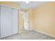 Bedroom with sliding door closet and tile flooring at 862 N Uvalda St, Aurora, CO 80011