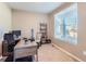 Bright home office with desk, chair, and shelving at 241 S Quantock St, Aurora, CO 80018