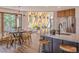 Modern kitchen with island, stainless steel appliances, and mountain views at 225 Bristlecone Way, Boulder, CO 80304