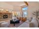 Spacious living room with stone fireplace and large windows at 225 Bristlecone Way, Boulder, CO 80304