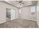 Main bedroom with ceiling fan and carpeted flooring at 12722 Cove St, Firestone, CO 80504