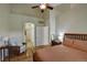 Main bedroom with hardwood floors and access to the bathroom at 6678 S Shawnee Ct, Aurora, CO 80016