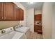 Laundry room with washer, dryer, and cabinets at 6678 S Shawnee Ct, Aurora, CO 80016