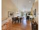 Open dining area with hardwood floors and a view of the living room and kitchen at 6678 S Shawnee Ct, Aurora, CO 80016