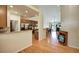 Open kitchen with granite countertops, stainless steel appliances, and hardwood floors at 6678 S Shawnee Ct, Aurora, CO 80016