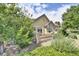 Landscaped backyard with gravel and a view of the house at 6678 S Shawnee Ct, Aurora, CO 80016