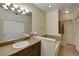 Bathroom with a soaking tub and double vanity at 6678 S Shawnee Ct, Aurora, CO 80016
