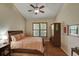 Bright bedroom with hardwood floors and a ceiling fan at 6678 S Shawnee Ct, Aurora, CO 80016