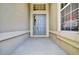 Front entrance with blue door, neutral-colored walls, and a small landing at 6678 S Shawnee Ct, Aurora, CO 80016