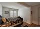 Bright bedroom with hardwood floors, a comfortable bed and a window with shutters at 6678 S Shawnee Ct, Aurora, CO 80016
