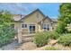 Landscaped backyard with gravel and a view of the house at 6678 S Shawnee Ct, Aurora, CO 80016