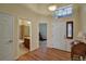 Bright entryway with hardwood floors and a half bathroom at 6678 S Shawnee Ct, Aurora, CO 80016