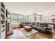 Relaxing living room with a fireplace, built-in shelving, and hardwood floors at 6972 Hampton Ct, Castle Pines, CO 80108