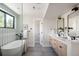 Spa-like bathroom with double vanity and soaking tub at 2009 S Clarkson St, Denver, CO 80210