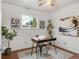 Home office with a mid-century modern desk, chair, and inspiring artwork at 909 Nelson St, Lakewood, CO 80215