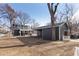 Large backyard with detached garage and a portion of house visible at 1025 Collyer St, Longmont, CO 80501