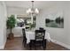 Spacious dining area with a large window and stylish artwork at 1025 Collyer St, Longmont, CO 80501