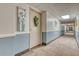 Clean condo hallway with light walls and carpeting at 13609 E Cornell Ave # 107, Aurora, CO 80014