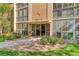 Building entrance with landscaping and walkway at 13609 E Cornell Ave # 107, Aurora, CO 80014