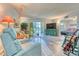 Bright living room featuring wood floors and access to a patio at 13609 E Cornell Ave # 107, Aurora, CO 80014