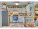Well-equipped kitchen with stainless steel appliances and granite countertops at 13609 E Cornell Ave # 107, Aurora, CO 80014