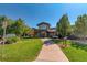 Community clubhouse with large windows and landscaping at 13609 E Cornell Ave # 107, Aurora, CO 80014