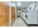 Convenient shared laundry room with multiple machines at 13609 E Cornell Ave # 107, Aurora, CO 80014