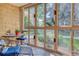 Sunroom offering ample natural light and views of the surrounding area at 13609 E Cornell Ave # 107, Aurora, CO 80014
